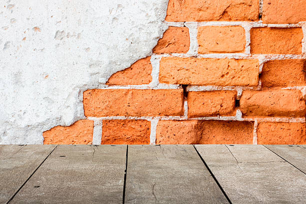 istock Wood table top on old cracked concrete vintage brick 544816988