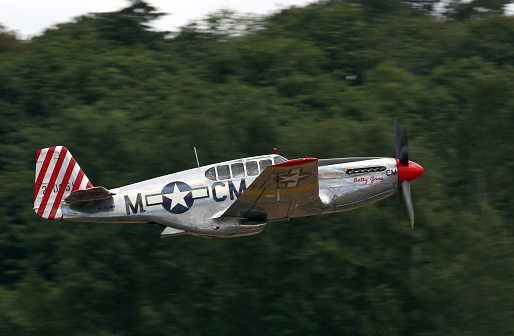 Seattle, Wa, United States - July 3, 2016: A very rare P-51C Mustang owned by the Collings Foundation was seeing flying in the skies over Seattle, WA. This is 1 of only 5 built during WWII.
