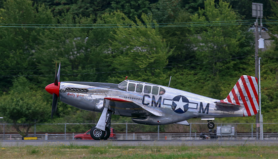 Seattle, Wa, United States - July 3, 2016: A very rare P-51C Mustang owned by the Collings Foundation was seeing flying in the skies over Seattle, WA. This is 1 of only 5 built during WWII.