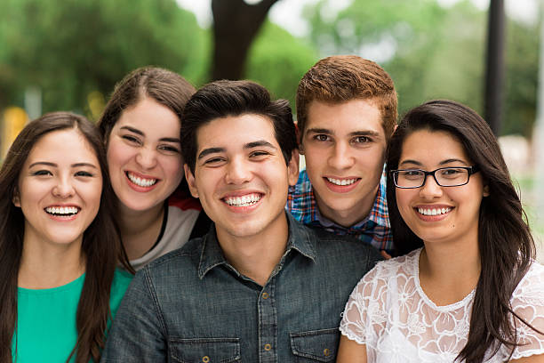 istock Groupg of young people smiling at camera 544820062