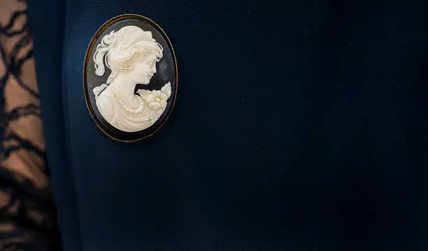 Victorian Shell Cameo Brooch circa 1890. worn an a black lace dress. Placing of the brooch gives a lot of copy space