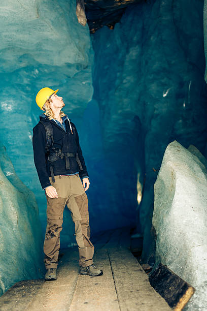 istock Scientist at an Expedition Site Examining a Glacier 544821276