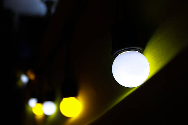 istock Close up of decorative light bulb on dark background 544821632