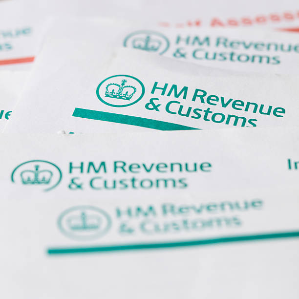 HM Revenue and customs forms London, United Kingdom - July 6, 2016: HM Revenue and customs forms background. HMRC is the department of the UK government that is responsible for the collection of taxes. hm government stock pictures, royalty-free photos & images