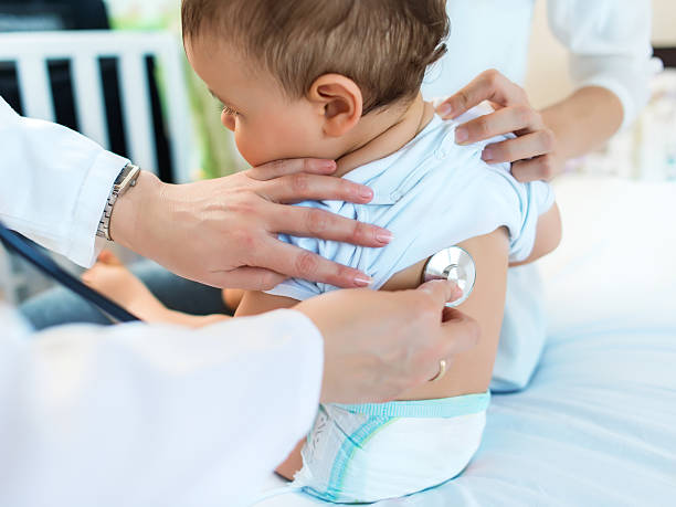 istock Cute baby boy at doctor's office 544821800