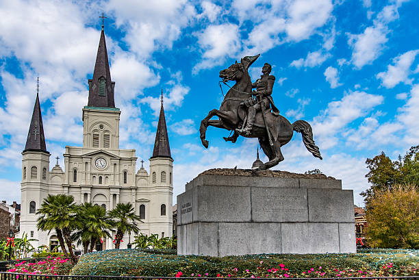 Jackson Square Statue set against the backdrop of a beautiful cathedral. french quarter stock pictures, royalty-free photos & images