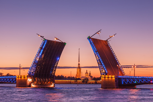 Opening of Palace drawbridge, White nights in Saint Petersburg, view of Peter and Paul Cathedral through the bridge