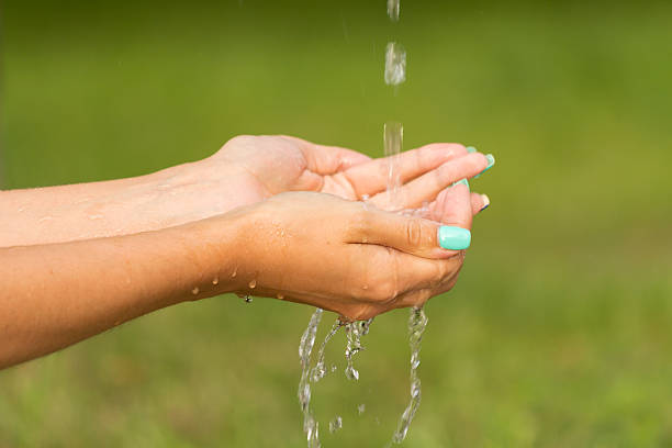 istock Hands girl in running fresh water 544958574