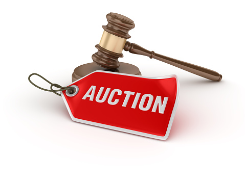Gavel with Auction Tag on White Background