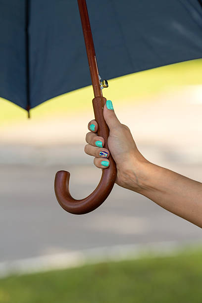 istock Hand girl with umbrella 544959344