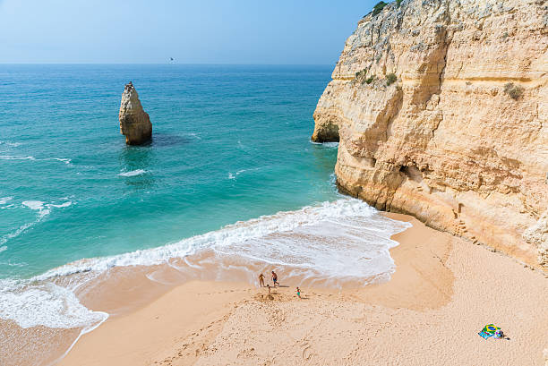 Family at beautiful beach Carvalho of Algarve, Portugal Family at beautiful beach Carvalho of Algarve, Portugal benagil photos stock pictures, royalty-free photos & images