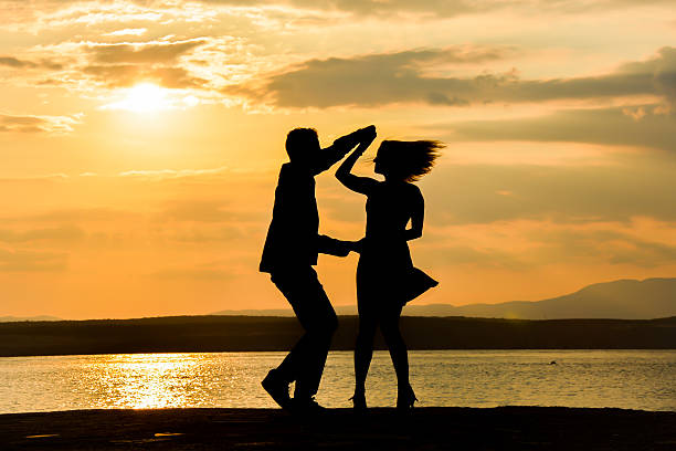 couple dancing salsa at sunset - sexual activity couple sensuality heat imagens e fotografias de stock