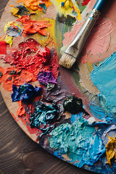 istock Closeup of paint mixing process in art workplace. 544965254