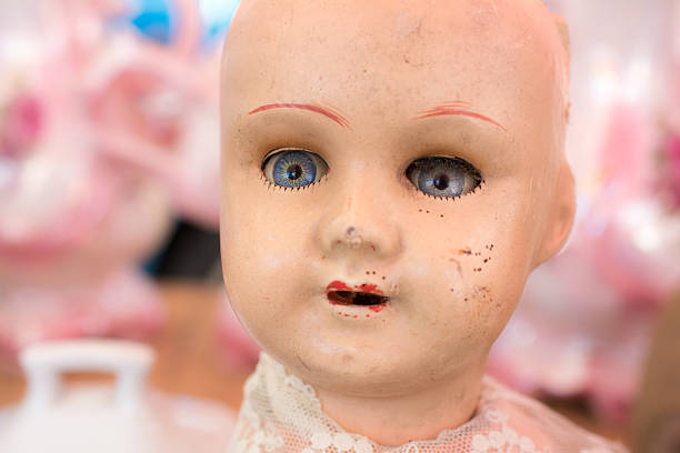 istock Vintage doll bald, blue eyes and a lace collar 544965702