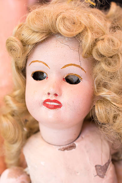 istock Vintage doll with blond curly hair and no eyes 544965888