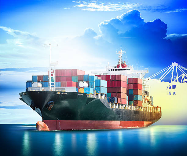 istock Container Cargo ship with ports crane bridge in harbor 544966078
