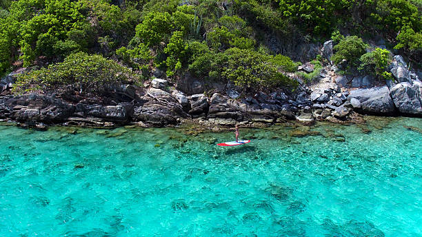 istock Aerial view of woman on paddleboard 544966334