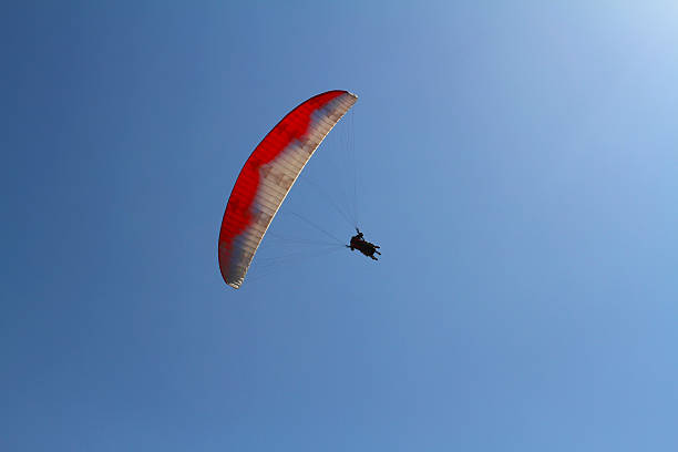 istock Paragliding in the sky, tandem of instructor and beginner 544968446