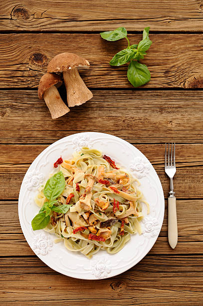 istock Colored pasta with wild mushrooms and basil 544969888
