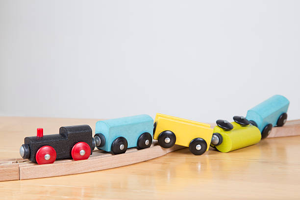 Career of the track - failure concept Derailed toy train - Conceptual image failure, lack of concentration derail stock pictures, royalty-free photos & images