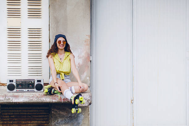 istock Smiling woman holding retro boom box 544973448