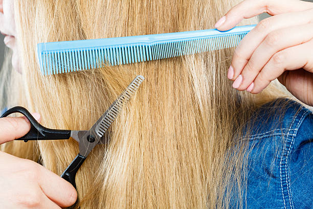 istock Woman cutting down smoothy hair. 544976760