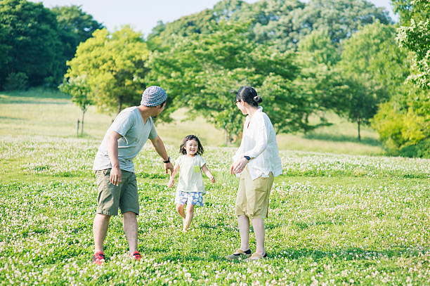 Family playing together in park Family having fun time in the outdoors japan photos stock pictures, royalty-free photos & images
