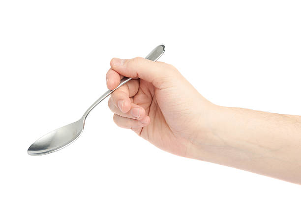 istock Male hand holding an empty spoon 544981536