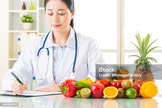 Doctor Nutritionist With Fruits And Vegetable Stock Photo - Download Image Now - Nutritionist, Japanese Ethnicity, Asia