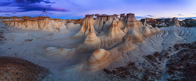 Sunset at Bisti Badlands in De-Na-Zin Wilderness, New Mexico, USA. This is a rolling landscape of badlands which offers some of the most unusual scenery found in the Four Corners Region.