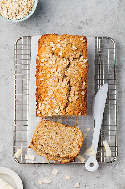 istock Healthy vegan oat, coconut loaf bread, cake on cooling rack 544986240