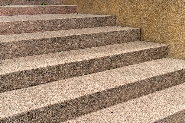 istock Brown concrete with small gravel staircase 544986430