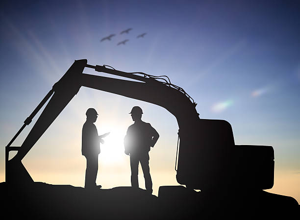 istock Silhouette Successful male engineer standing survey work on cons 544986704