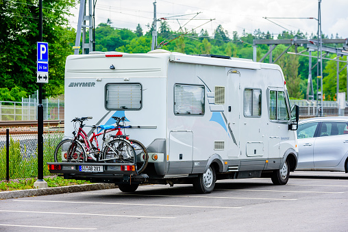 Motala, Sweden - June 21, 2016: Mobile home or camper using up many parking places with an illegal parking.