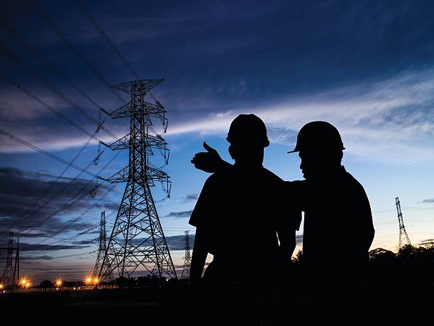 istock silhouette man survey and civil engineer stand on ground working 544988552
