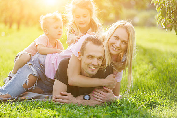 istock Family playing in the park on the grass 544990094