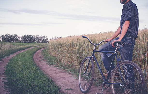 istock Mature man standing with retro bike 544990698