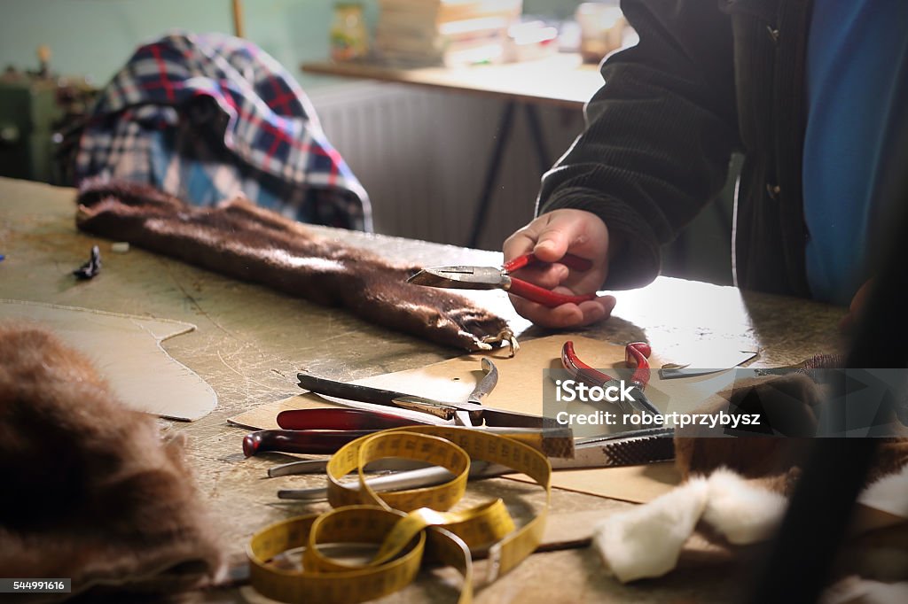 Workshop, studio furrier Workshop furrier, utensils, tools and pieces of natural fur Art And Craft Stock Photo