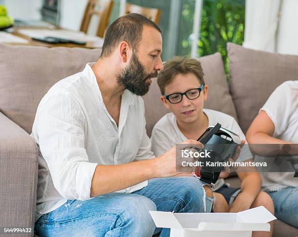 Family And A Breadboard Stock Photo - Download Image Now - Activity, Adult, Adults Only