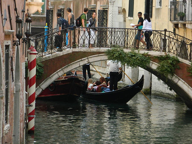 Gondolas with tourists stock photo