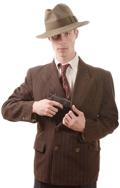 istock gangster in a suit vintage, with handgun 545080512