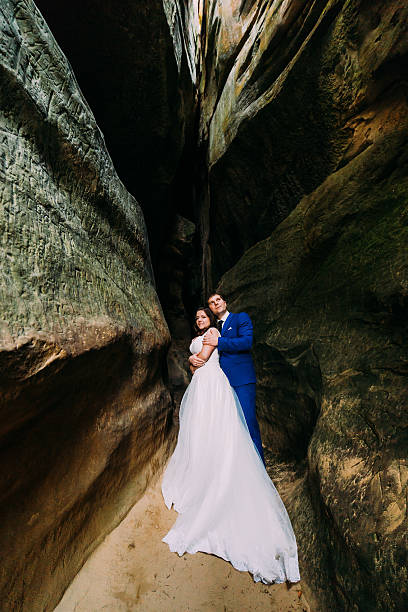istock Young and romantic bride with her loving groom posing in 545080854