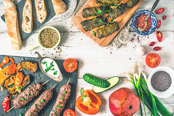 istock Kebabs with dolma, seasoning and vegetable  top view 545084282