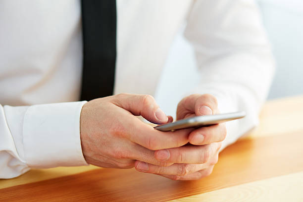 istock Man holding a cell phone 545085088