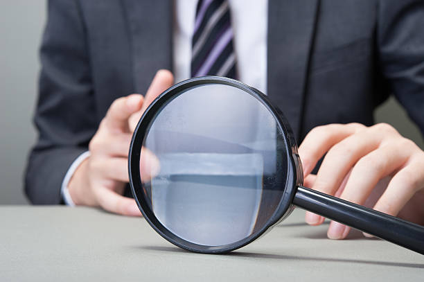 istock Businessman and magnifying glass 545085654