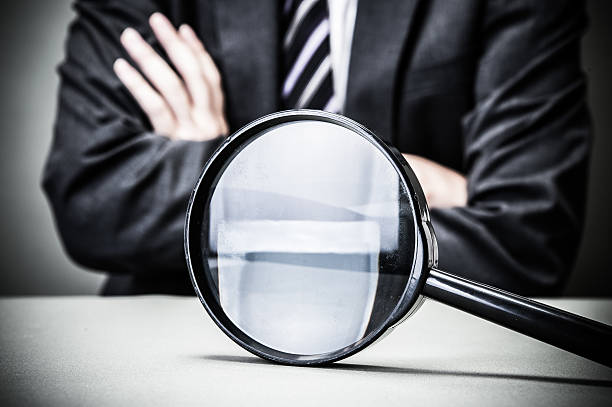 istock Businessman and magnifying glass 545085686