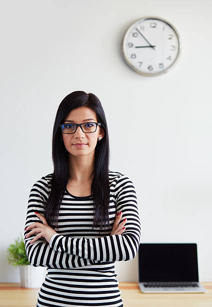 istock Woman standing with arms crossed 545085696