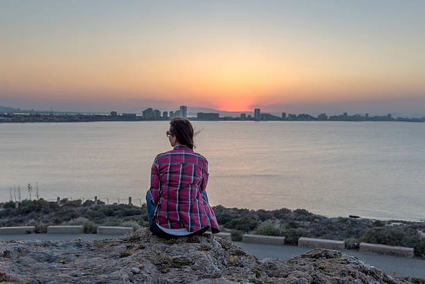istock Woman watching sunset. Mediterranean, Spain. June 03, 2016. 545086690