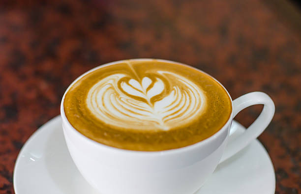 istock Barista making a cup of coffee soft focus image . 545087354
