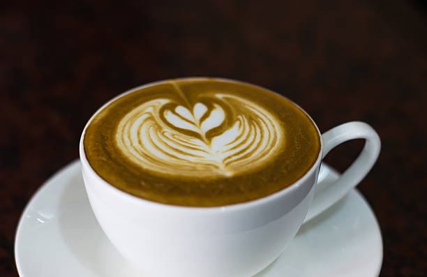 istock Barista making a cup of coffee soft focus image . 545087436